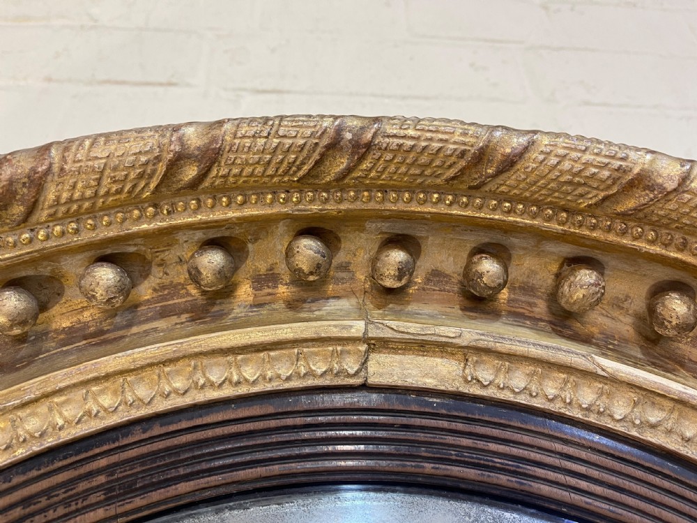 Early Nineteenth Century giltwood convex mirror  View II