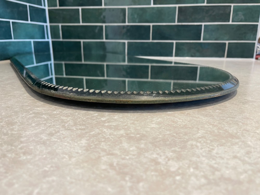 An oblong mirrored plateau tray featuring a decorative clear beaded glass border designed to lie flat on a surface. View III