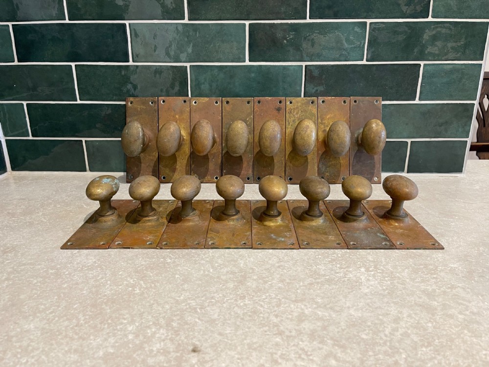 Sixteen brass door handles 