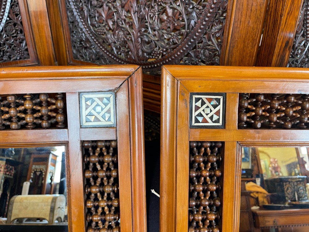 A pair of rectangular wooden wall mirrors featuring Moorish lattice panels and geometric bone inlays. View II