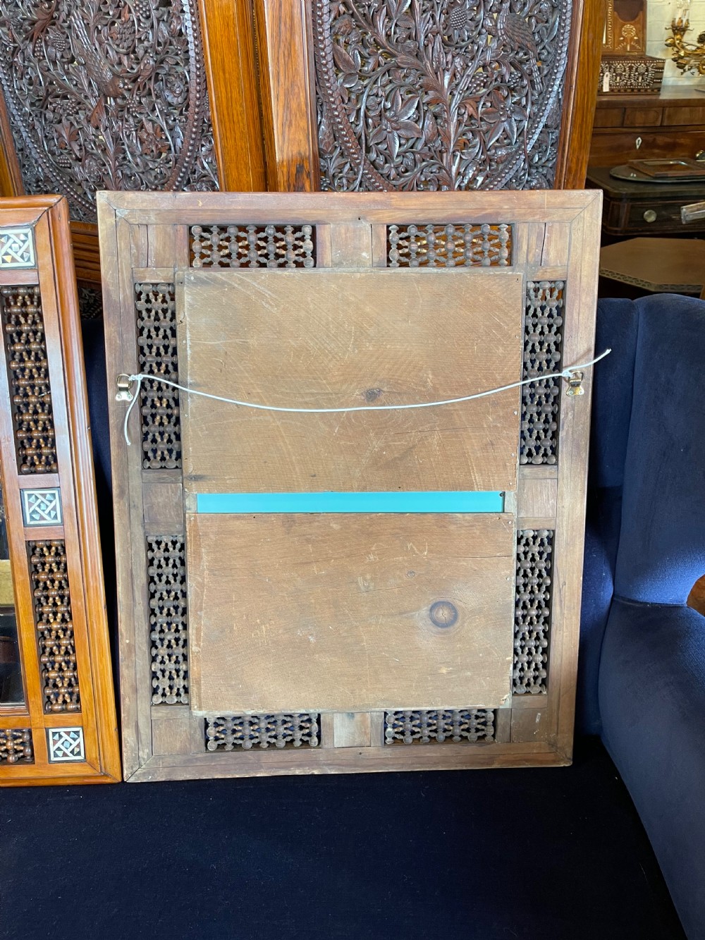 A pair of rectangular wooden wall mirrors featuring Moorish lattice panels and geometric bone inlays. View IV