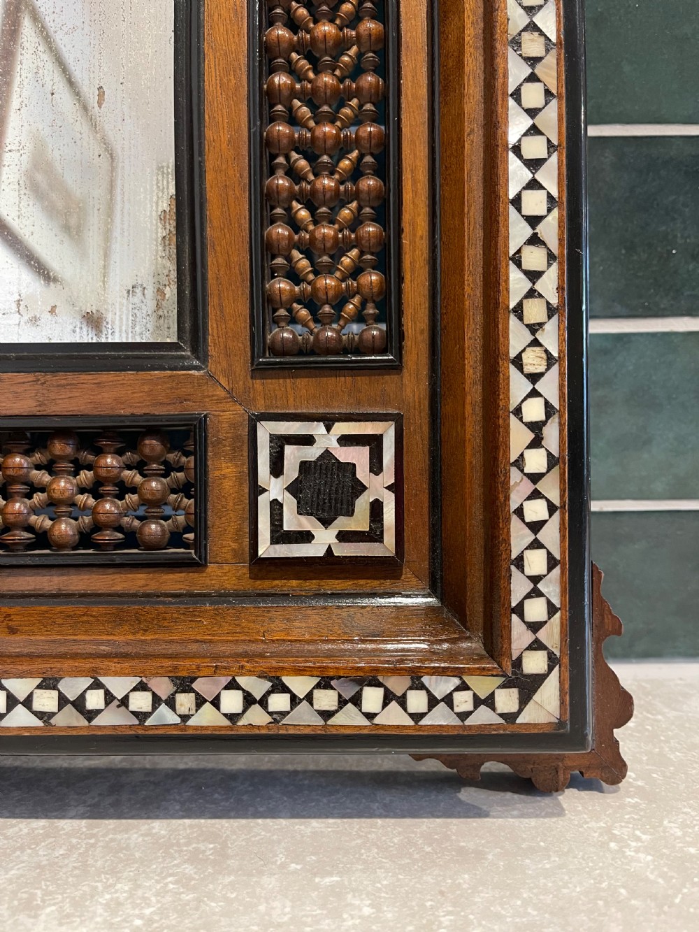 A matching pair of dark walnut wall mirrors featuring intricate mother-of-pearl inlay and decorative turned wood lattice panels framing central rectangular mirrors. View II