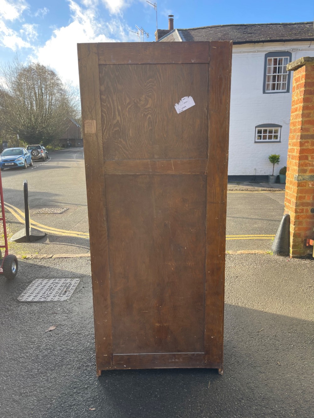 A tall Victorian golden oak Amberg patent filing cabinet featuring twin vertical columns of index drawers marked with alphabetical labels. View III