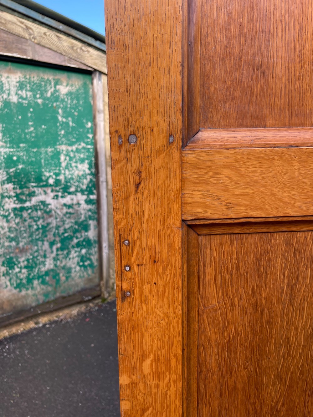A tall Victorian golden oak Amberg patent filing cabinet featuring twin vertical columns of index drawers marked with alphabetical labels. View VI