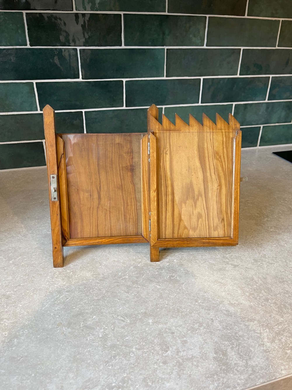 A standing wooden double photo frame constructed in the form of a slatted garden gate with metal strap hinges and a sliding latch. View III