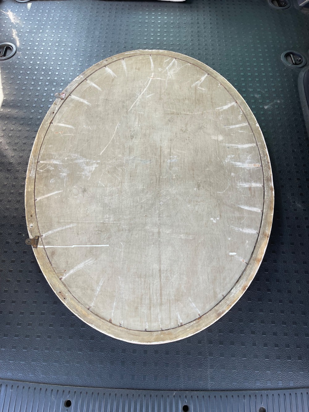 A large Edwardian oval wall mirror featuring a painted off-white frame decorated with a beaded border trim. View II