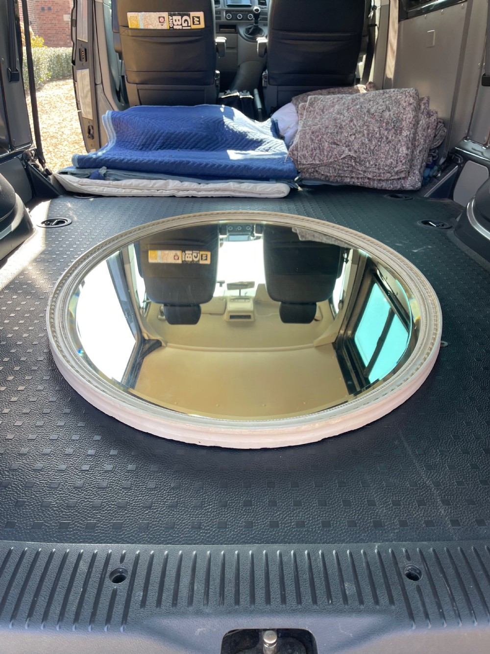 A large Edwardian oval wall mirror featuring a painted off-white frame decorated with a beaded border trim. View IV
