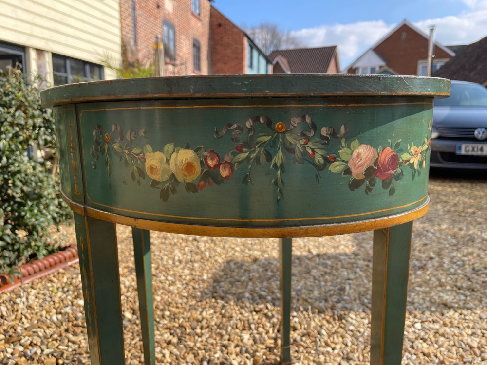 A late Victorian kidney-shaped writing desk finished in green paint with hand-painted floral swags and an inset leather top. View III