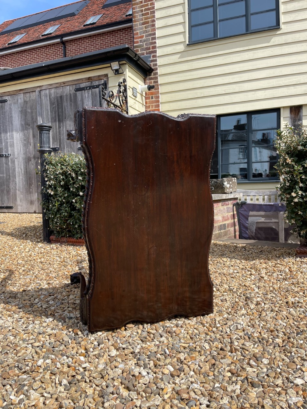 A dark mahogany Chippendale style side table featuring carved ball-and-claw feet, carved knees, and a blind fretwork apron. View VI
