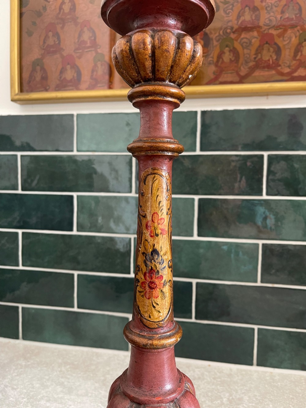 A pair of tall Italian carved wooden candlestick table lamps decorated with terracotta red paint, gold leaf accents, and faux candle sleeves. View III
