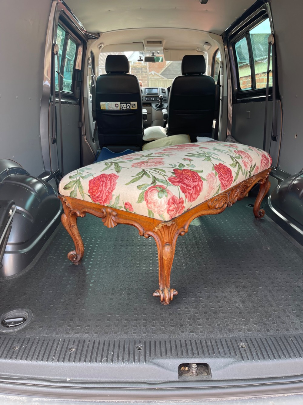 A rectangular Victorian rosewood footstool featuring carved cabriole legs, a shell apron motif, and floral upholstery in pink and red tones. View III