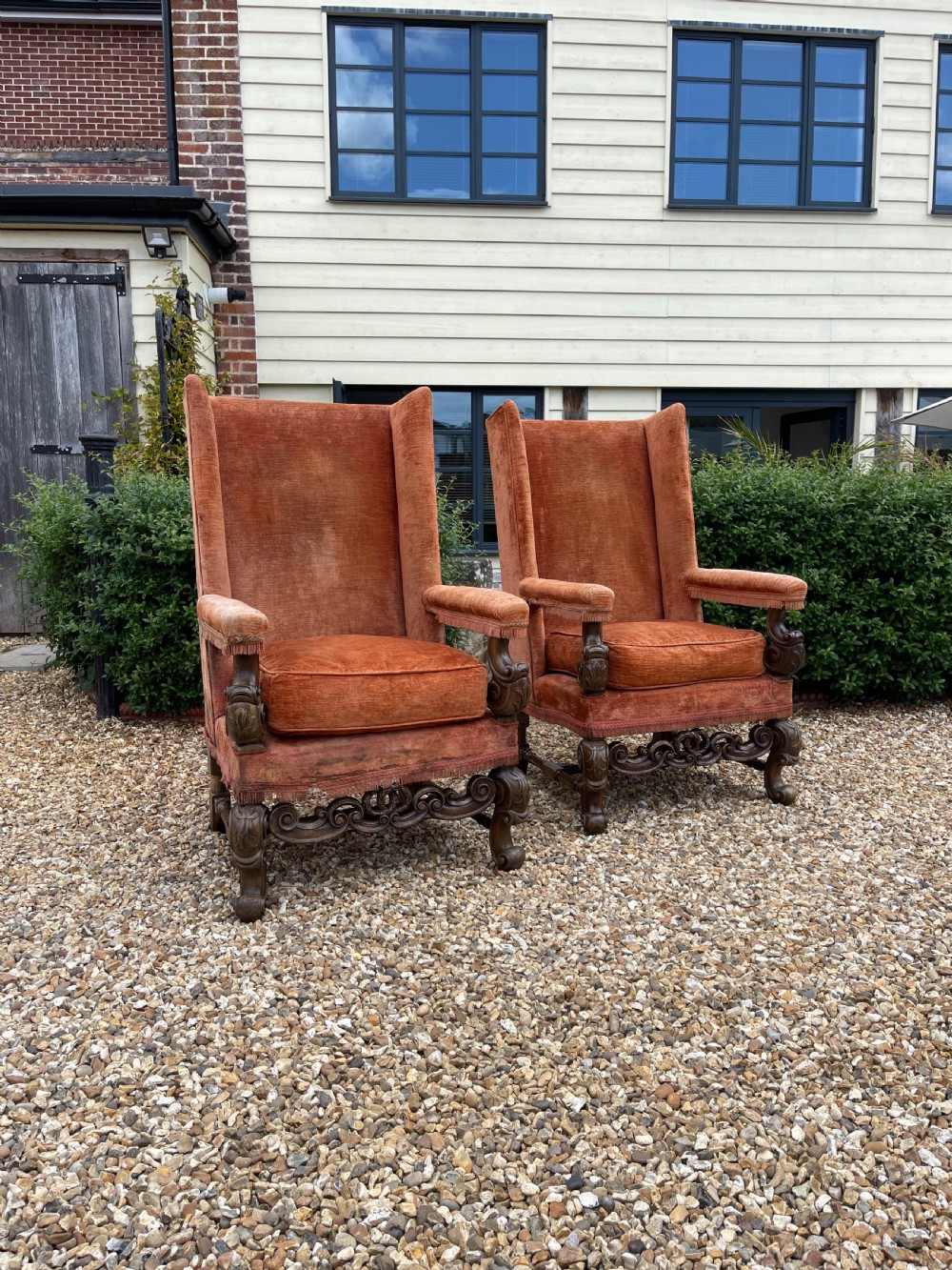 Pair of large walnut armchairs 