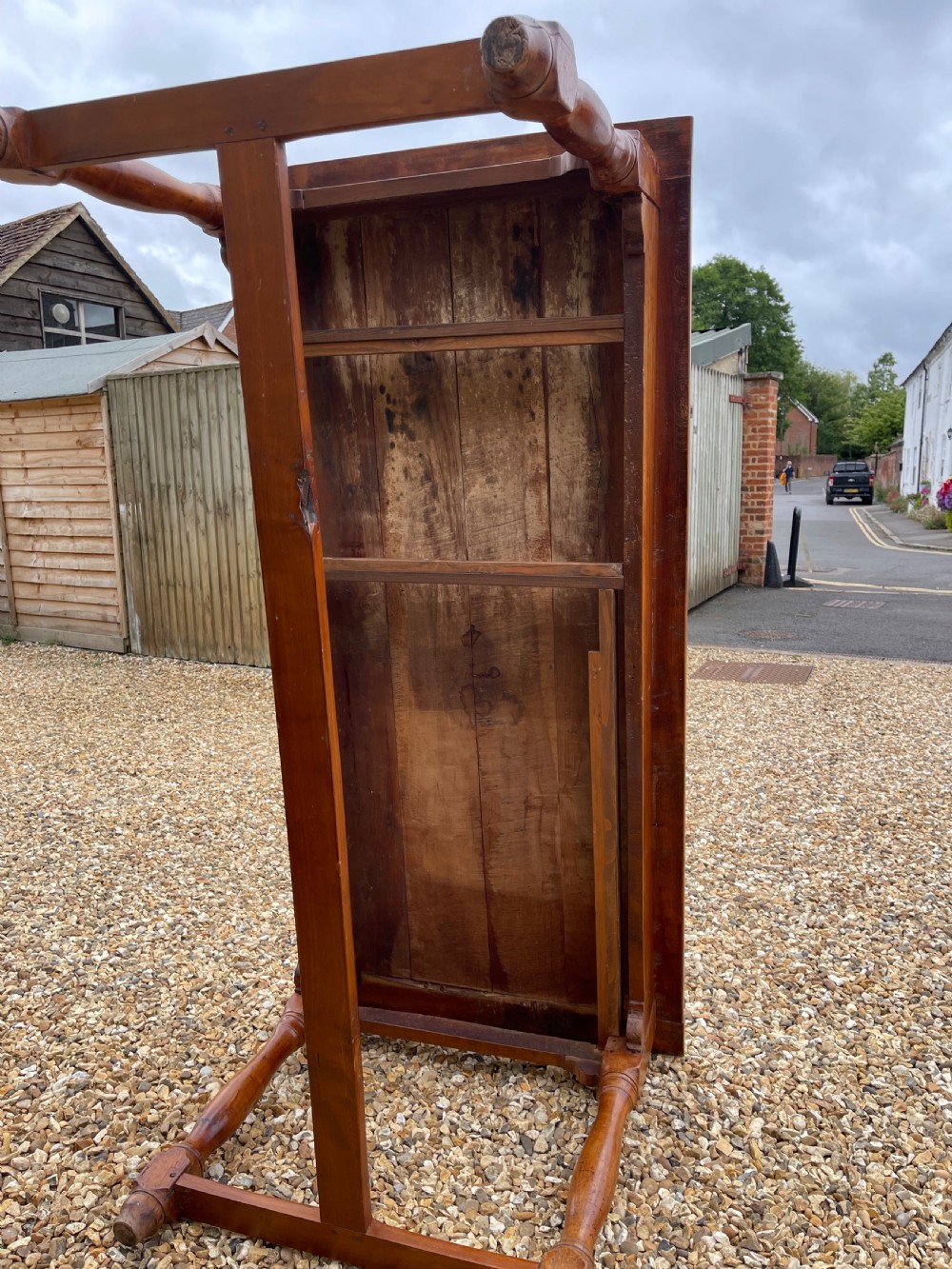 A nineteenth-century rectangular cherrywood table featuring a single frieze drawer, turned legs, and an H-stretcher base. View VI