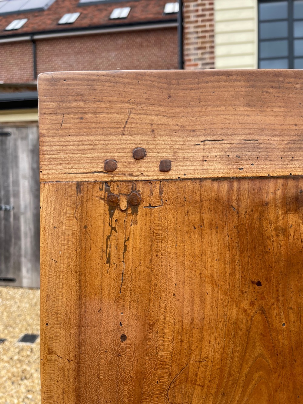 A nineteenth-century rectangular cherrywood table featuring a single frieze drawer, turned legs, and an H-stretcher base. View VIII