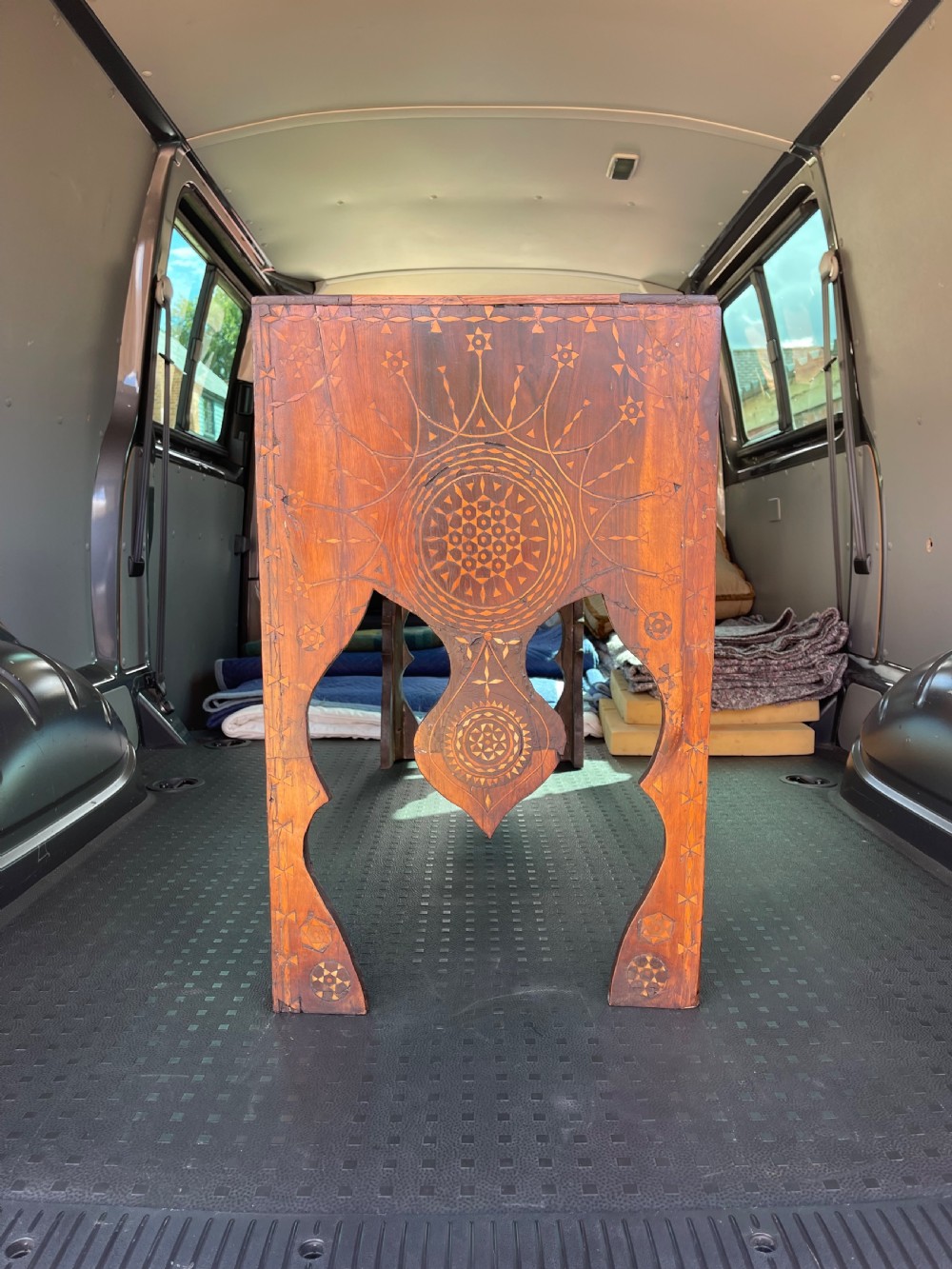 An elongated rectangular walnut console table with intricate geometric bone inlay across the top, apron, and side supports. View VII