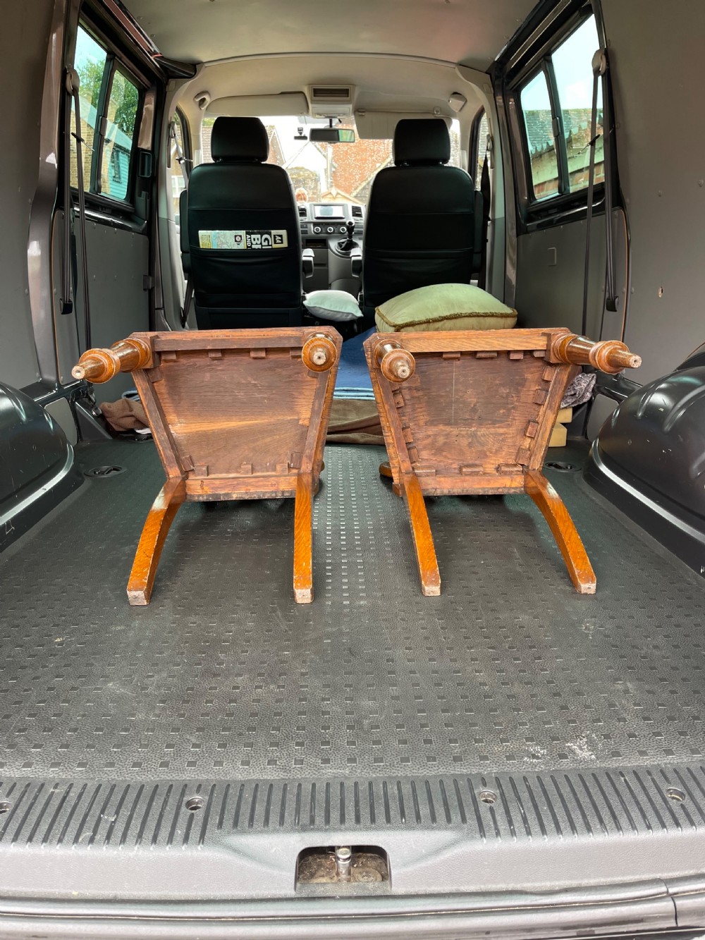A pair of 19th-century oak hall chairs featuring carved pierced backrests, flat solid wooden seats, and turned front legs. View IV