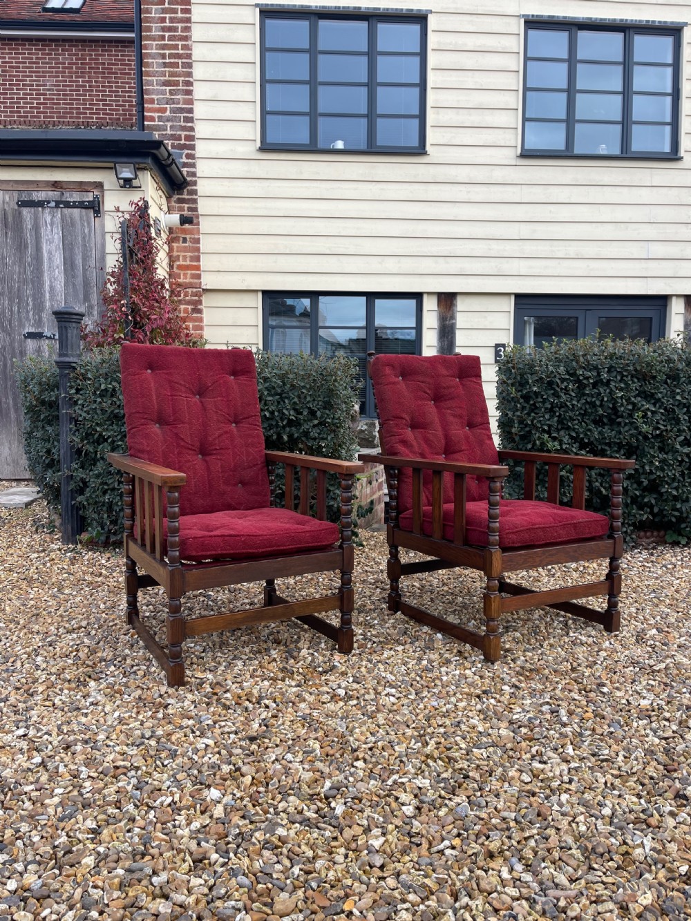 Pair of oak reclining armchairs 