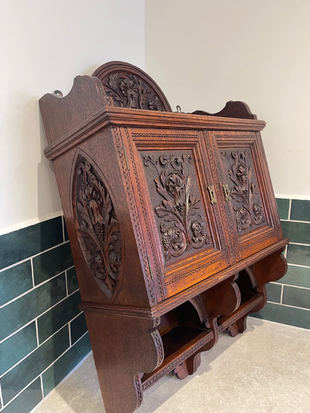 Carved oak wall cupboard  View II