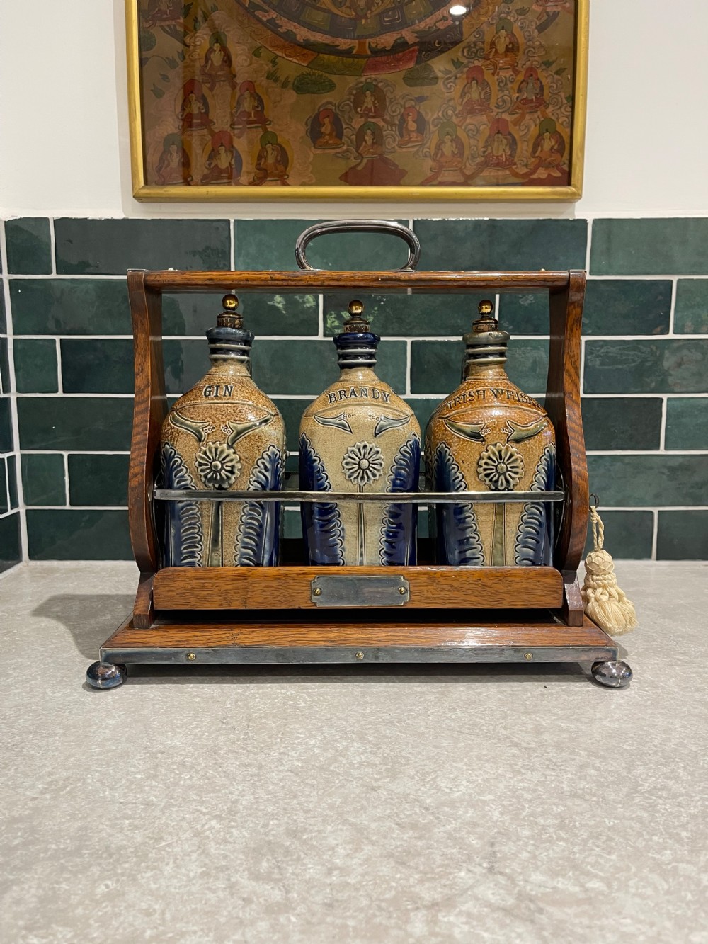 Nineteenth Century oak tantalus with stoneware flagons