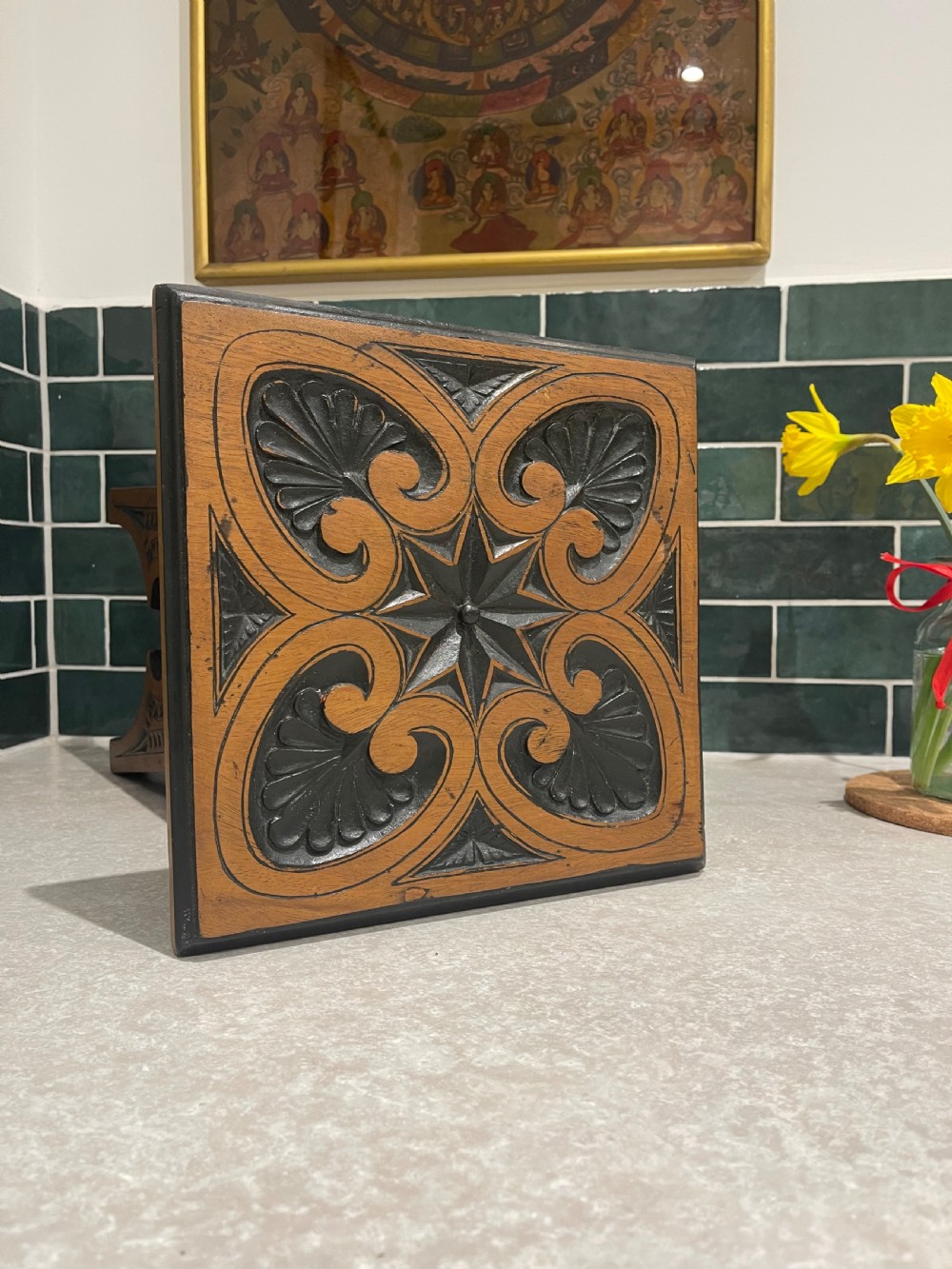A carved walnut occasional table featuring ebonised geometric chip carving, shell motifs, and four tapered flared legs. View IV