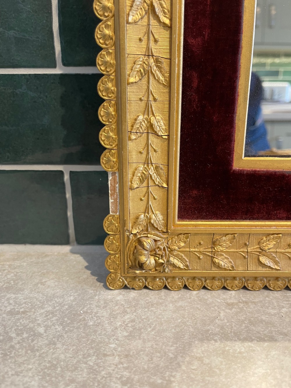 A pair of nineteenth-century rectangular mirrors featuring gold gilt frames decorated with leaf mouldings and lined with inner borders of crimson red velvet. View VI