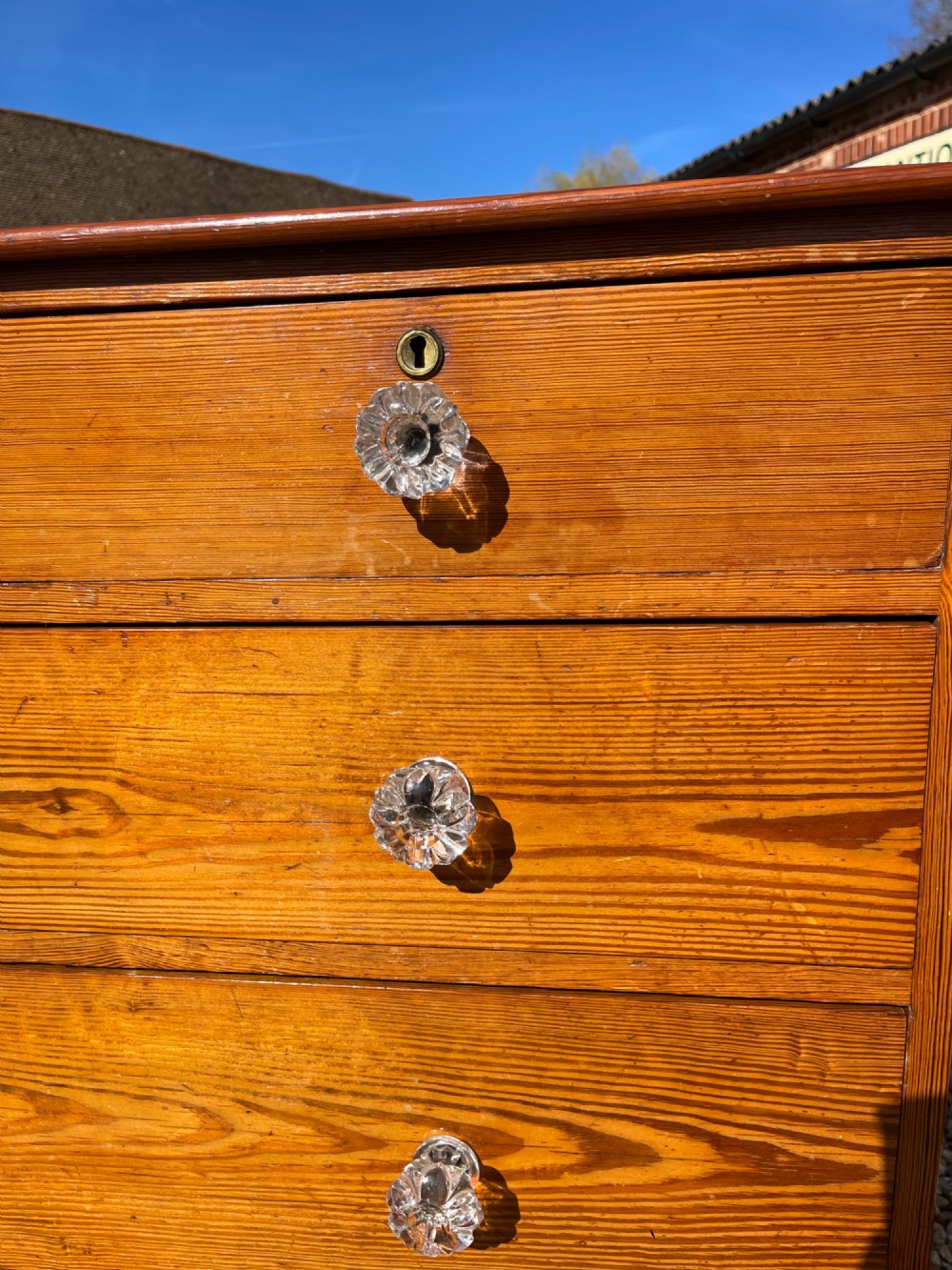 A Victorian pitch pine chest of drawers featuring two short drawers above three long graduated drawers with cut-glass handles. View III