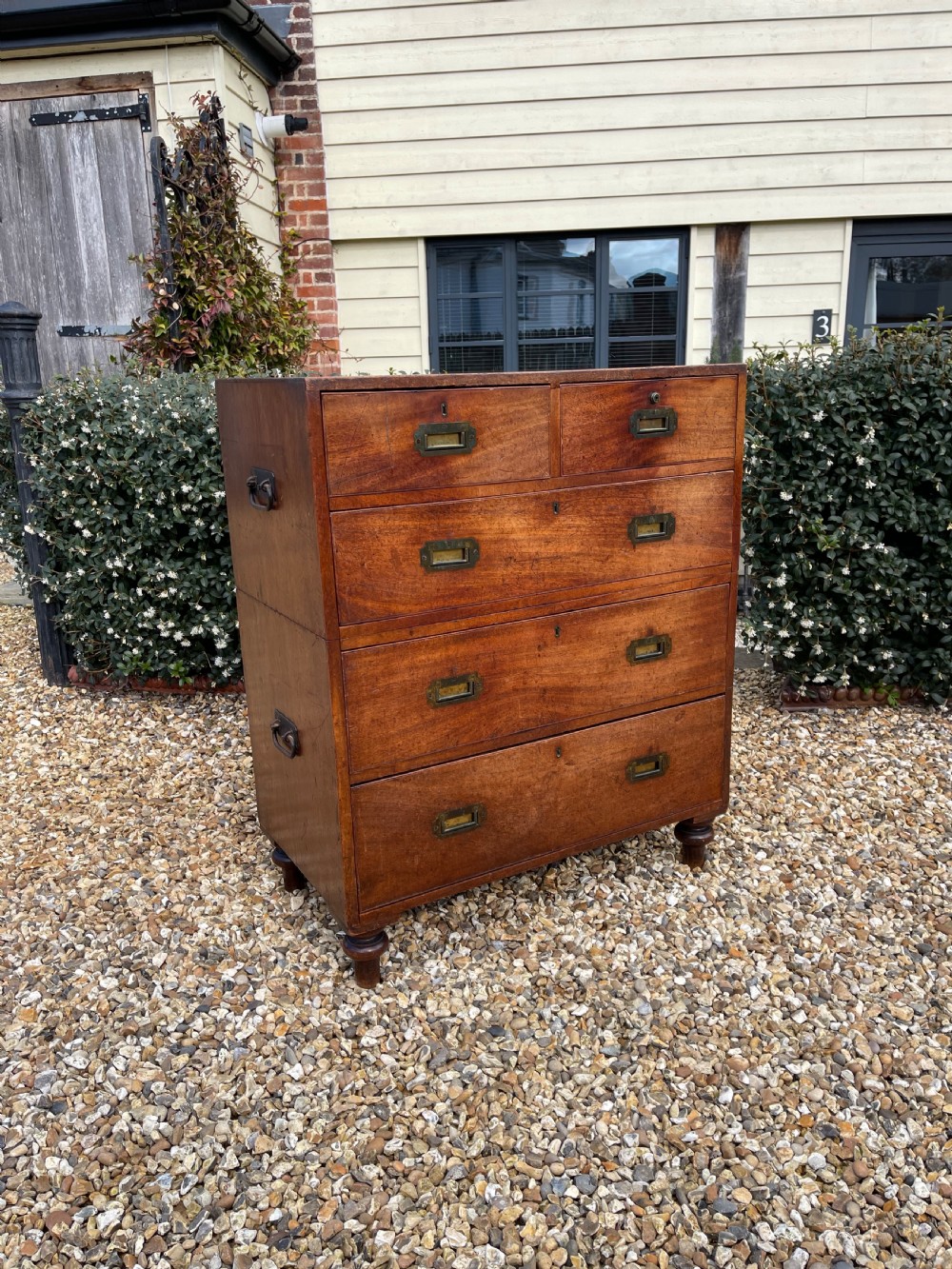 Neat sized mahogany campaign chest 