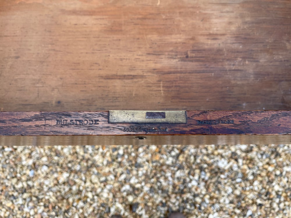 A dark oak press chest with four graduated drawers, turned knobs, bun feet, and a top-mounted wooden screw mechanism. View III