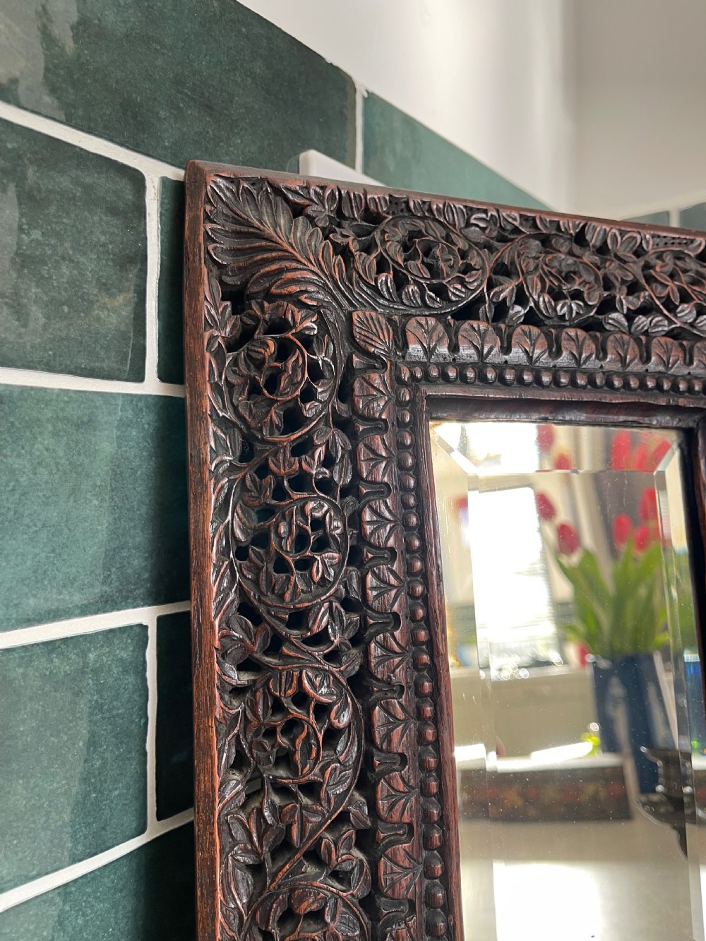 A pair of rectangular dark carved hardwood wall sconces featuring intricate floral openwork frames, inset rectangular mirrors, and central brass candle arms. View II