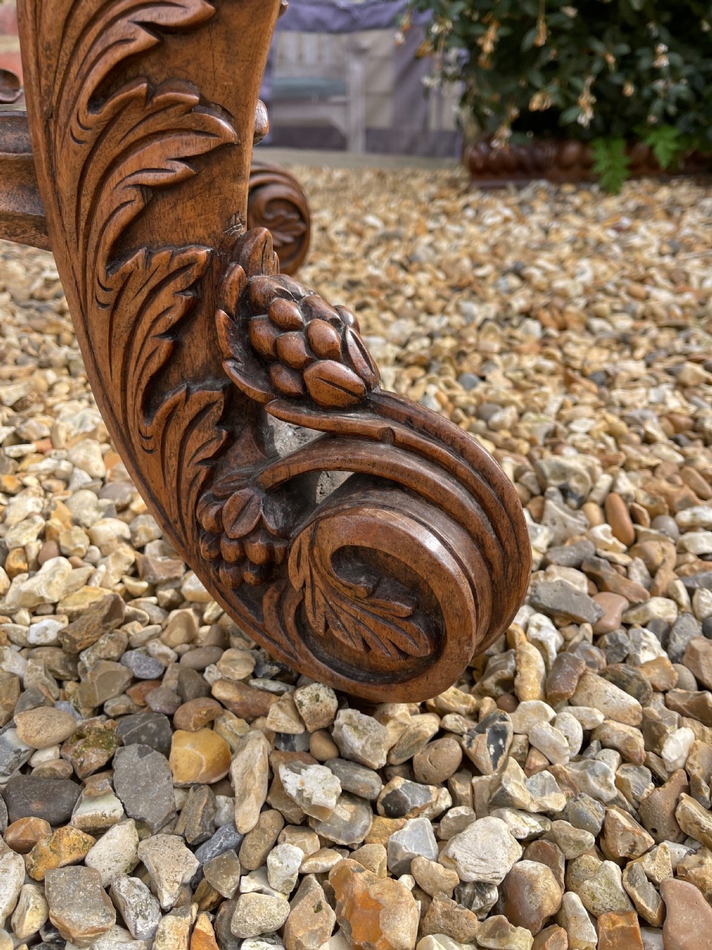 A nineteenth-century Anglo-Indian carved wood console table featuring a detailed openwork apron, gallery back, and intricately carved leg supports. View III