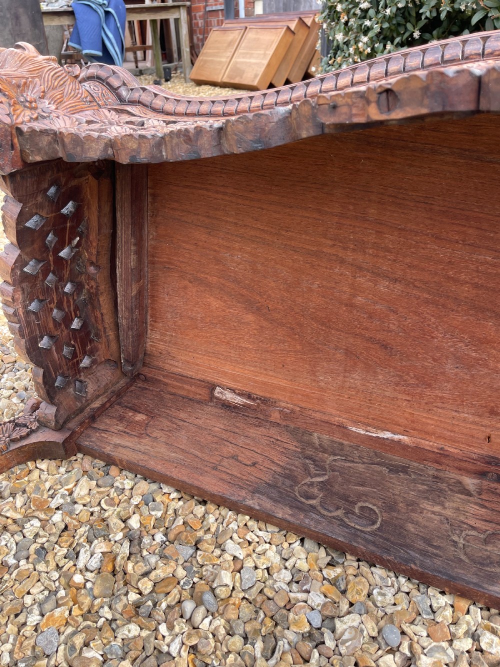 A nineteenth-century Anglo-Indian carved wood console table featuring a detailed openwork apron, gallery back, and intricately carved leg supports. View VIII