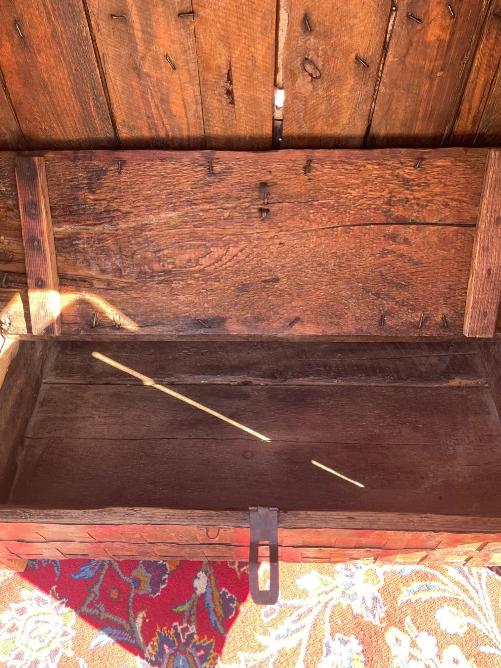 A tall nineteenth-century Indian wooden cupboard bound in dark iron lattice strapping with metal latches and double doors. View IV