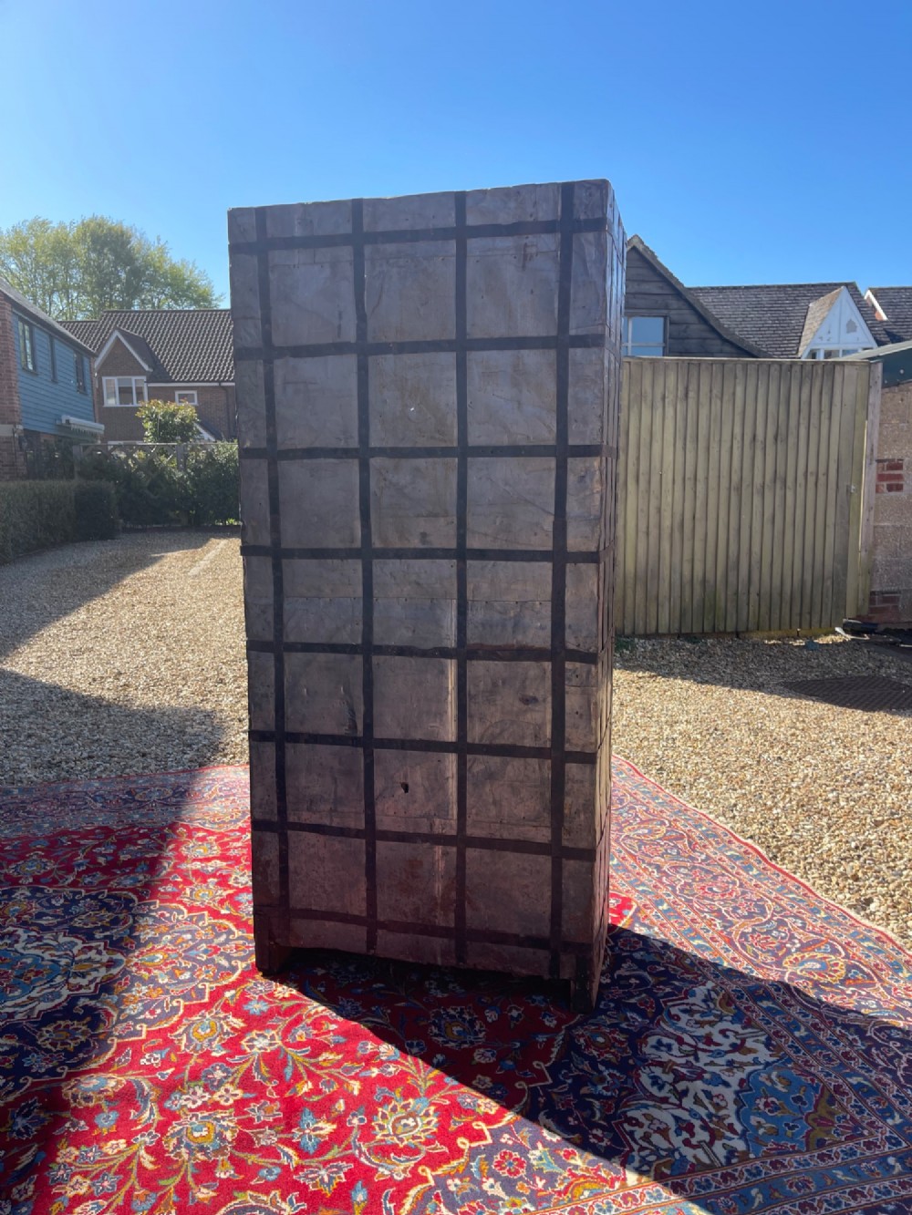A tall nineteenth-century Indian wooden cupboard bound in dark iron lattice strapping with metal latches and double doors. View VII