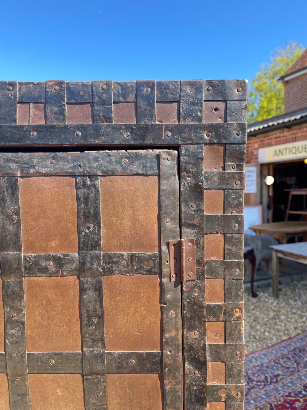A tall nineteenth-century Indian wooden cupboard bound in dark iron lattice strapping with metal latches and double doors. View IX