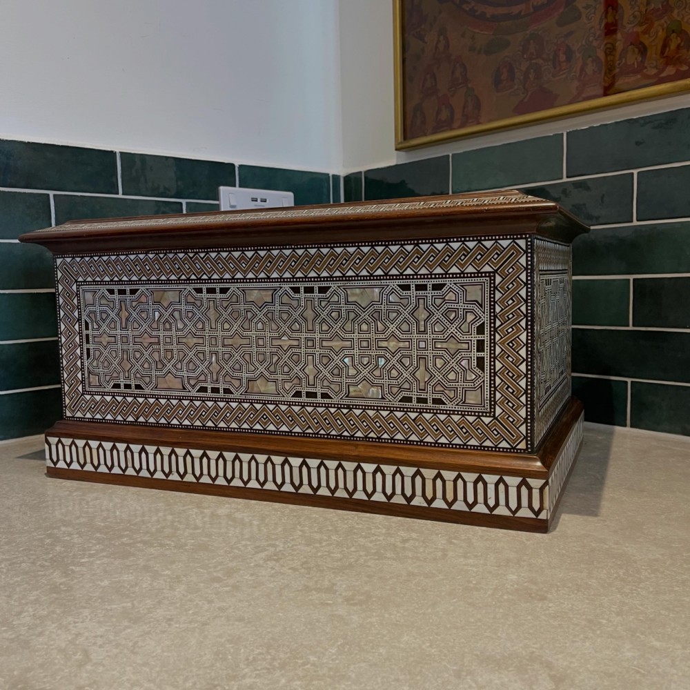 An Ottoman wooden tabletop cabinet featuring geometric mother-of-pearl and bone inlay, with a open side door revealing internal drawers. View IV