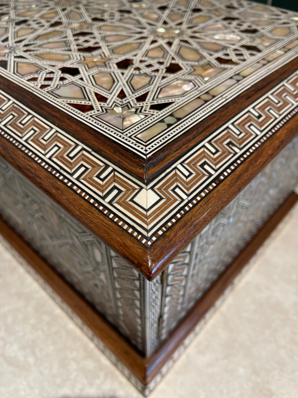 An Ottoman wooden tabletop cabinet featuring geometric mother-of-pearl and bone inlay, with a open side door revealing internal drawers. View VI