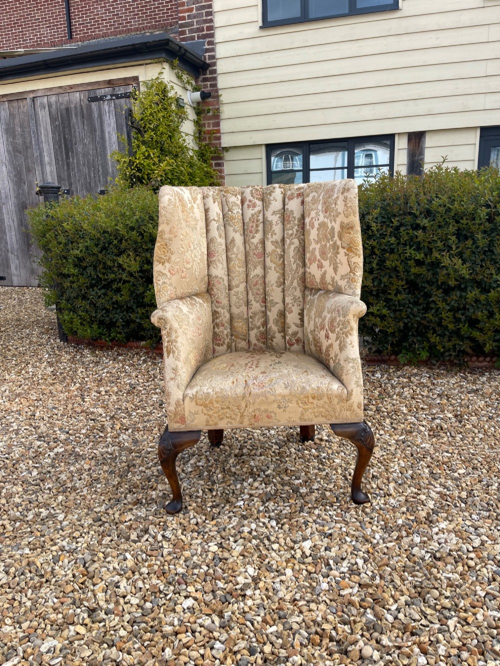 A high-backed floral tapestry wingback armchair featuring carved shell details on cabriole front legs. View II