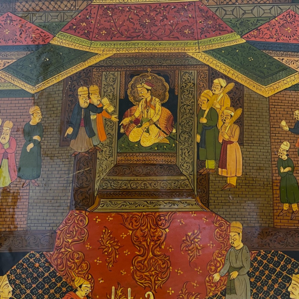 An octagonal Kashmiri papier-mache tray featuring a detailed hand-painted court scene with figures surrounded by a calligraphic border. View II
