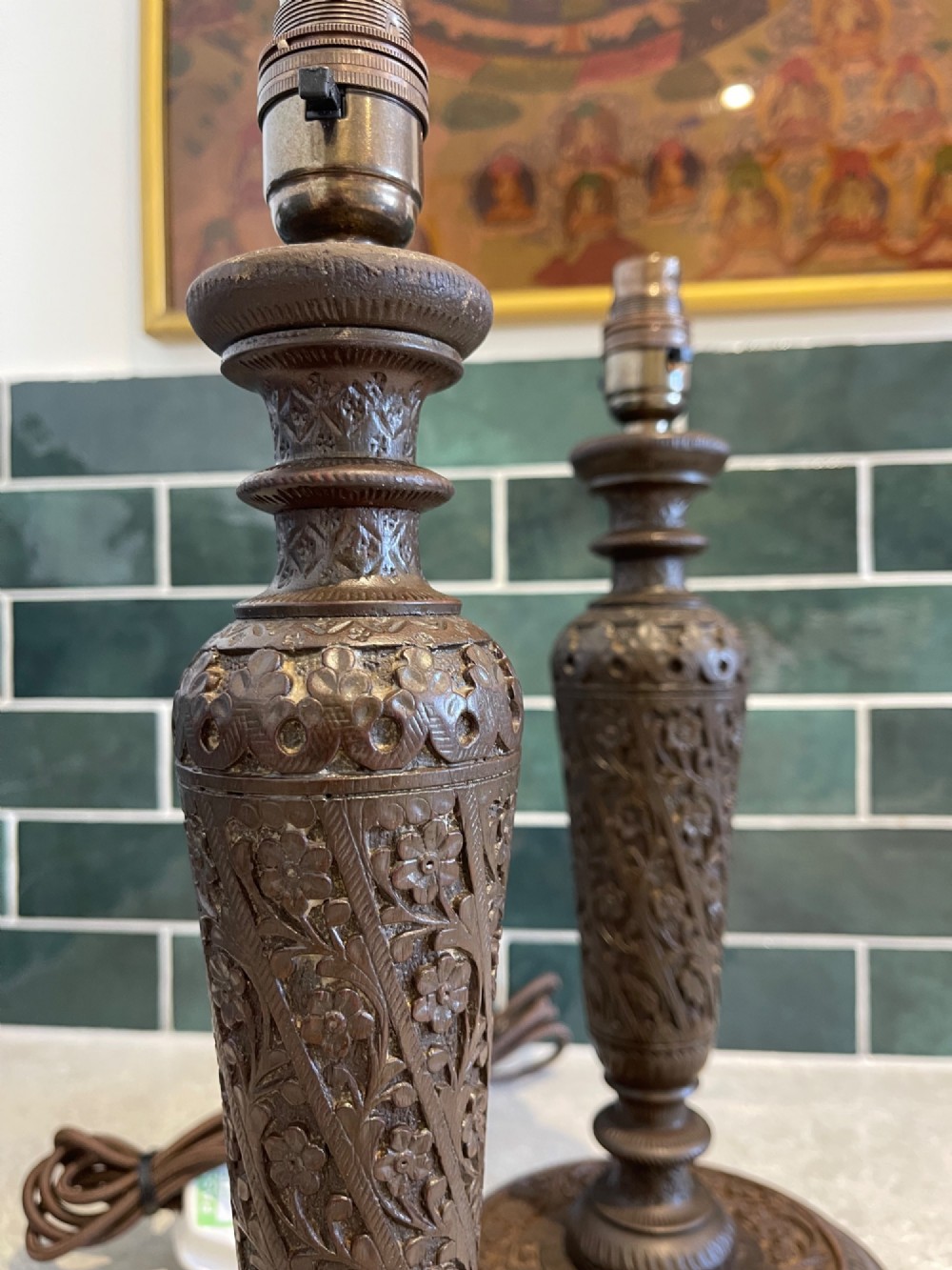 A pair of hand-carved dark brown walnut table lamp bases featuring turned baluster columns and detailed floral relief carving. View II