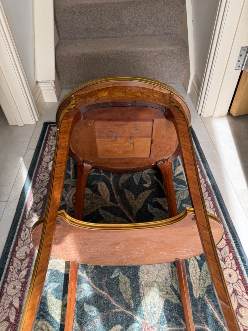 An oval French Louis XV style kingwood side table featuring a mottled red marble top, pierced brass gallery, floral marquetry inlay, and cabriole legs with bronze mounts. View III