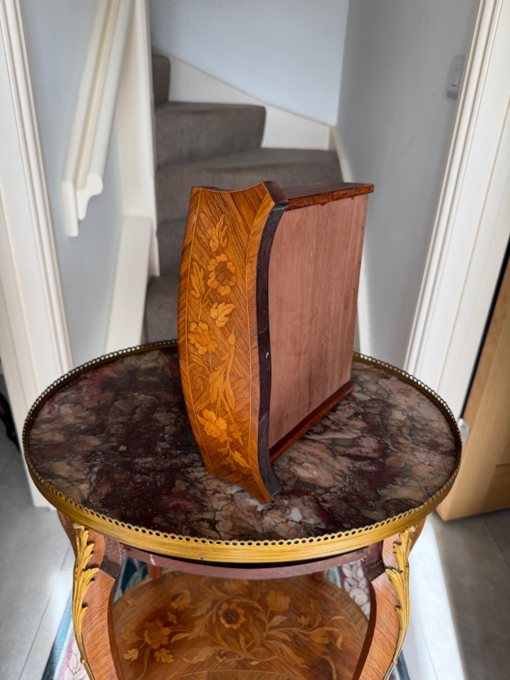 An oval French Louis XV style kingwood side table featuring a mottled red marble top, pierced brass gallery, floral marquetry inlay, and cabriole legs with bronze mounts. View V
