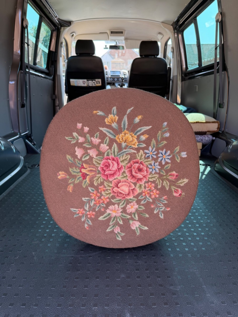 An oval walnut stool featuring carved cabriole legs and a brown upholstered tapestry seat decorated with subtle floral embroidery. View II