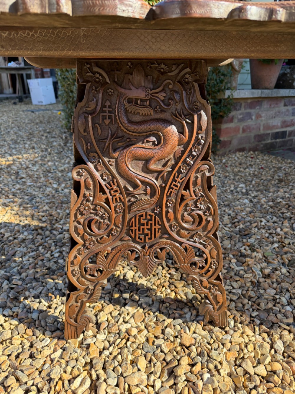 A hand-carved dark walnut side table featuring relief-carved dragon motifs across a lobed top and pierced decorative legs. View IV