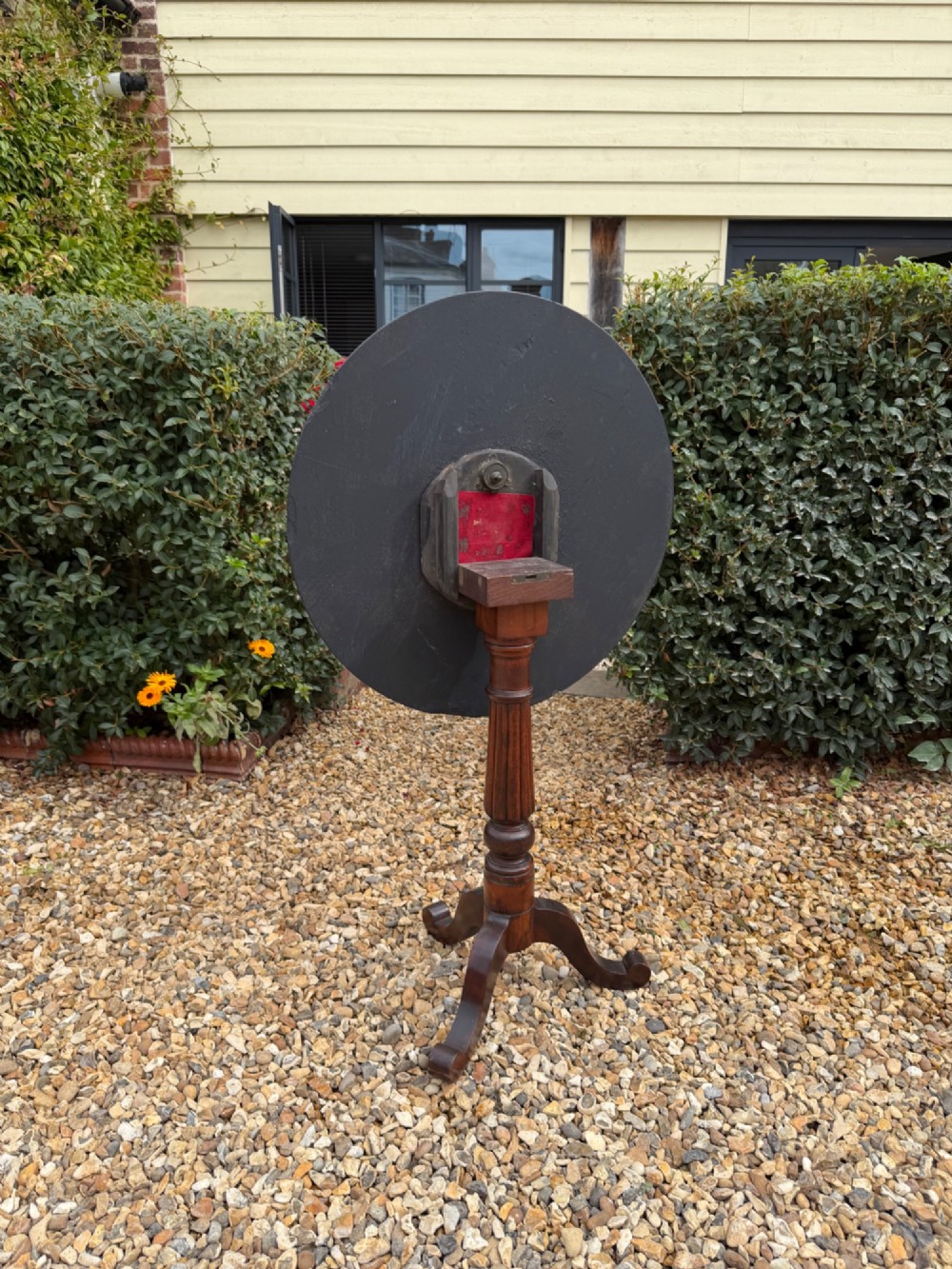 A nineteenth-century circular side table featuring a black slate top decorated with hand-painted botanical flowers and a gilt border, raised on a fluted dark wood pedestal stem with tripod legs. View III