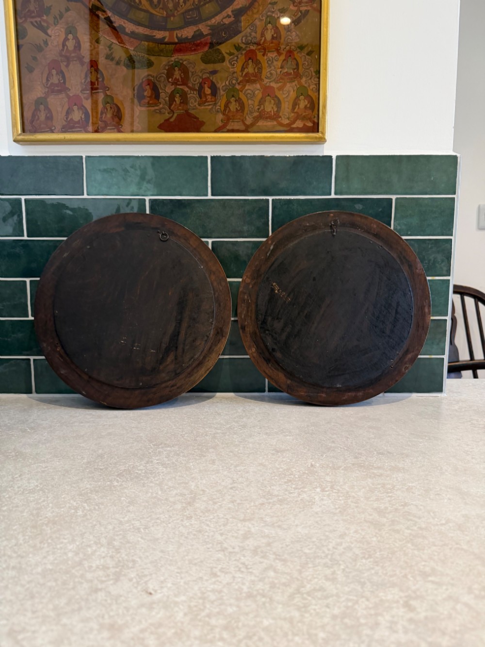 A pair of circular mirrors set in deep moulded warm brown walnut wood frames. View IV