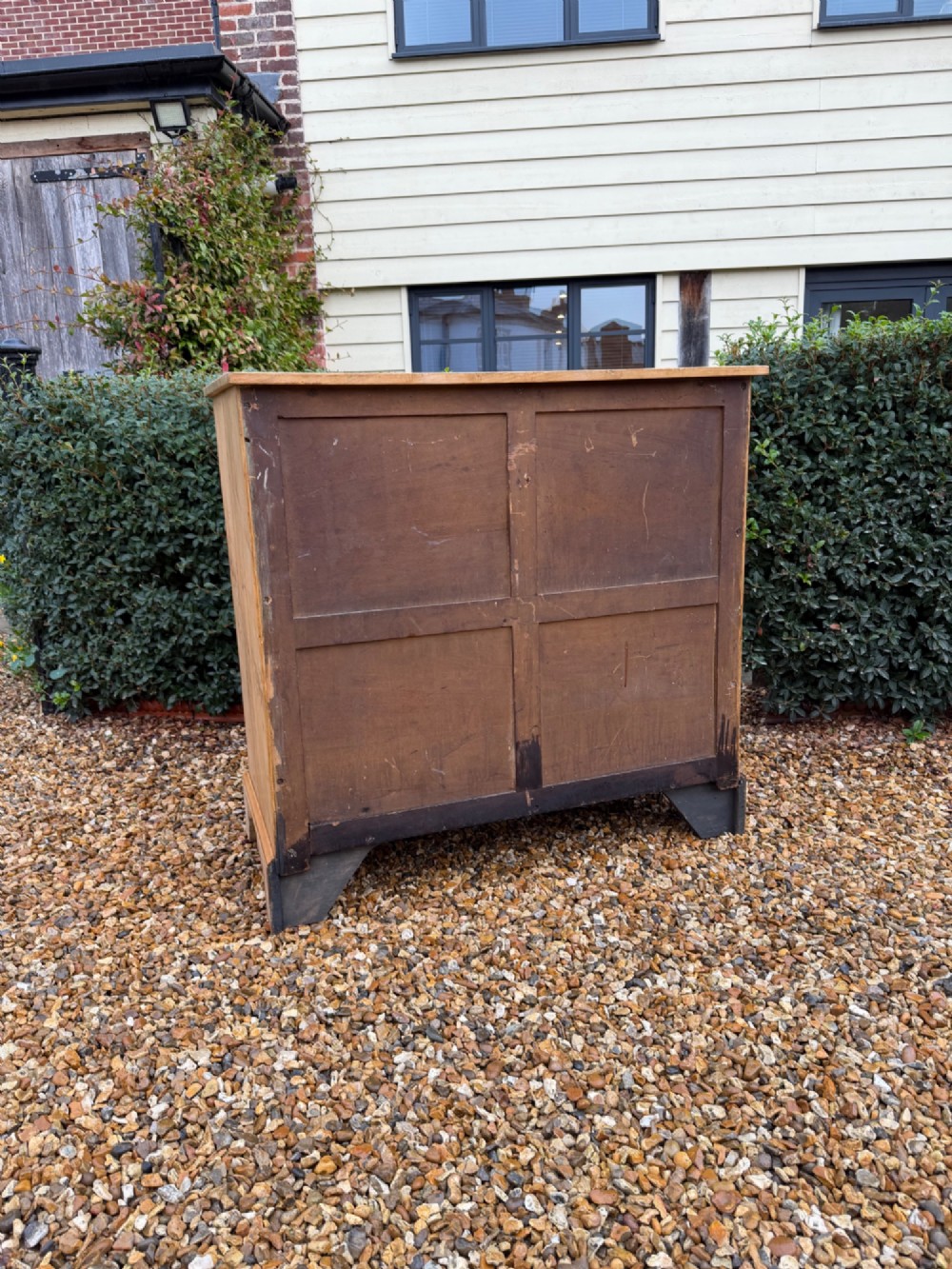 A nineteenth-century light maple chest of drawers featuring a two-over-three drawer arrangement, turned wooden handles, and bracket feet. View V