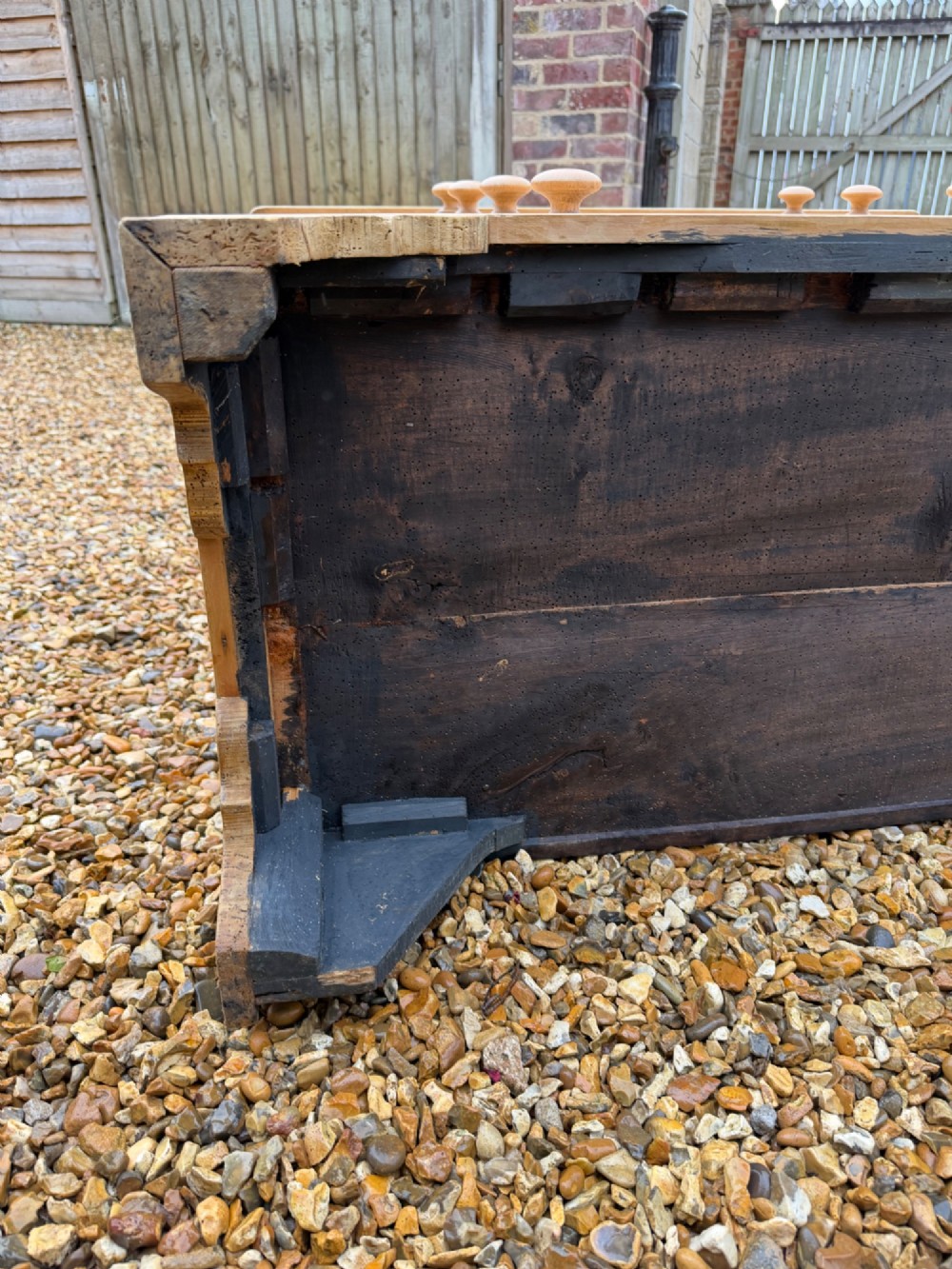A nineteenth-century light maple chest of drawers featuring a two-over-three drawer arrangement, turned wooden handles, and bracket feet. View VI