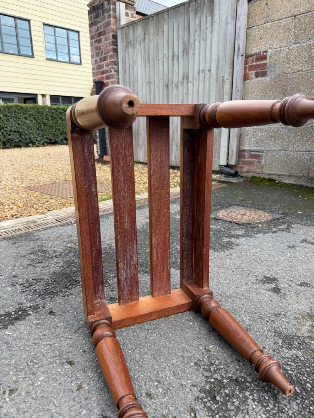 A Victorian warm brown timber luggage rack featuring a slatted wooden top supported by four turned legs. View II