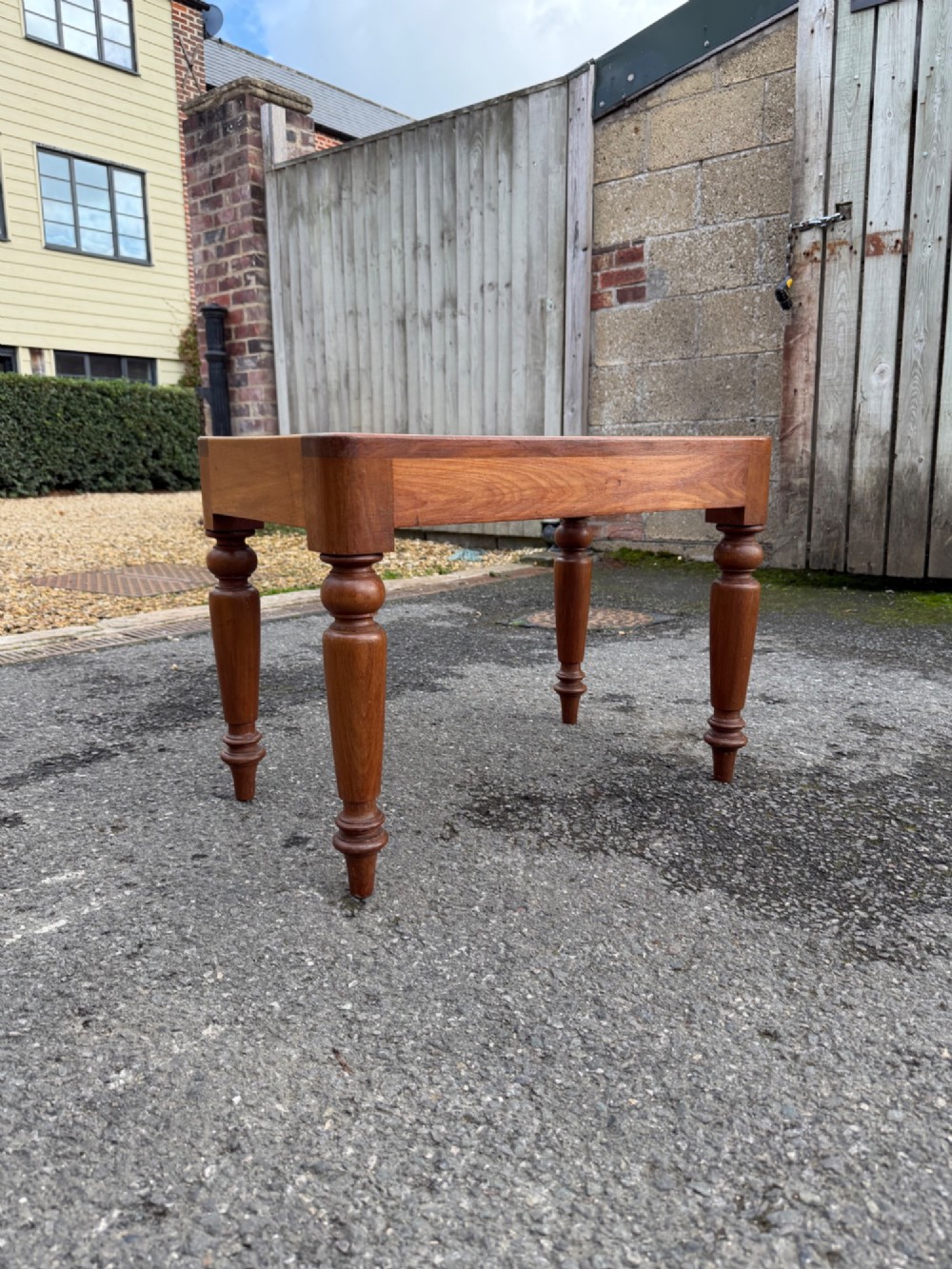 A Victorian warm brown timber luggage rack featuring a slatted wooden top supported by four turned legs. View IV