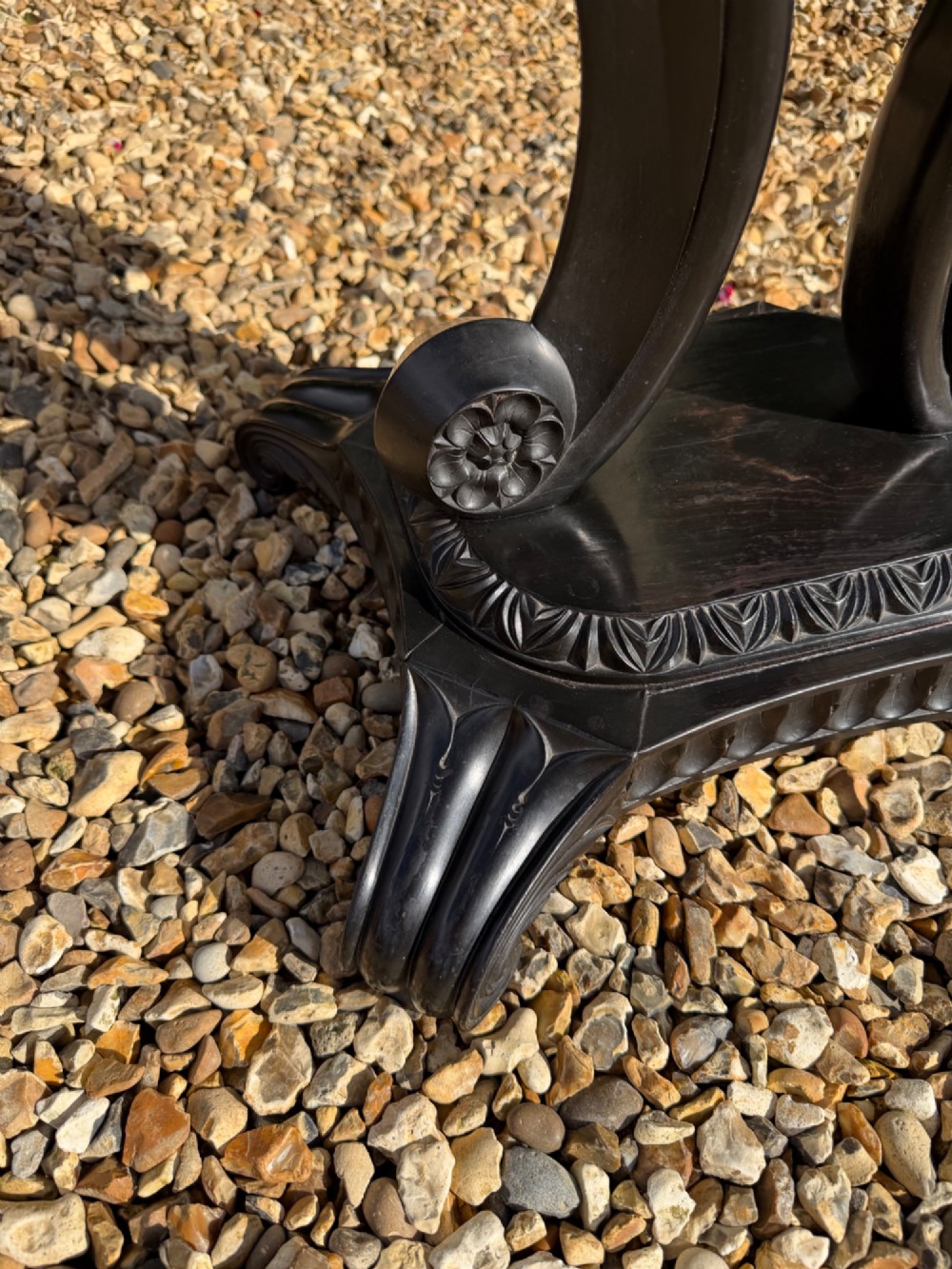A pair of 19th-century Ceylonese ebony hexagonal occasional tables featuring inlaid geometric specimen wood tops and carved scroll legs. View VIII